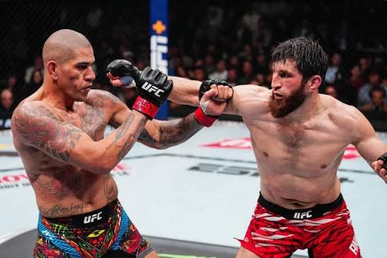 Two UFC fighters exchange strikes inside the octagon during a classic bout