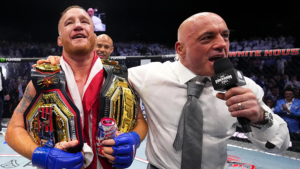 Justin Gaethje holds the UFC lightweight title belt after his title-winning fight