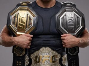 UFC lightweight title belt on display next to the octagon fence