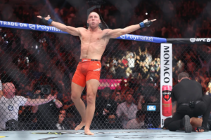 Paddy Pimblett celebrates his submission win at UFC 329, boosting his lightweight title chances.