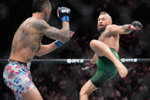 Max Holloway celebrating his TKO win over Conor McGregor at UFC 329.