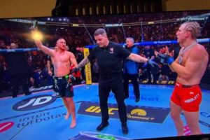 Justin Gaethje celebrates his lightweight title win, the man standing between Paddy Pimblett and gold.