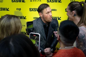 Conor McGregor speaks during UFC 329 fight week media interviews.